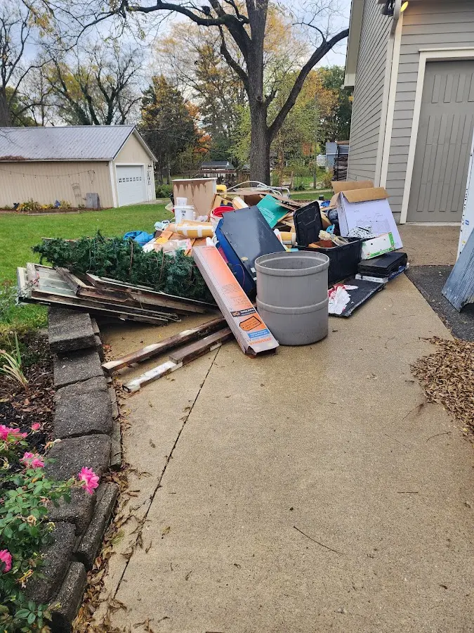 Dumpster being loaded with debris for Residential Dumpster Rental in Carmichael